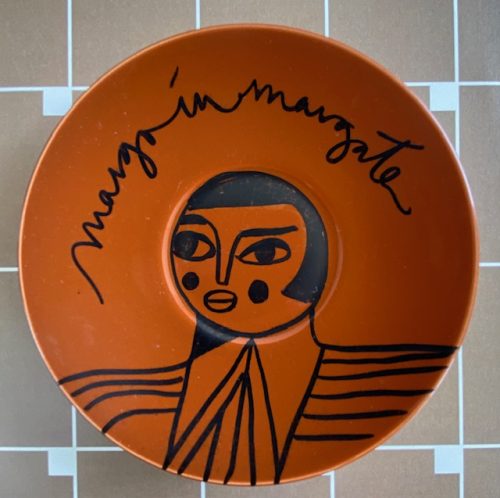 girl on little brown plate